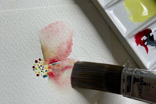 a close up of a watercolour flower on a greeting card