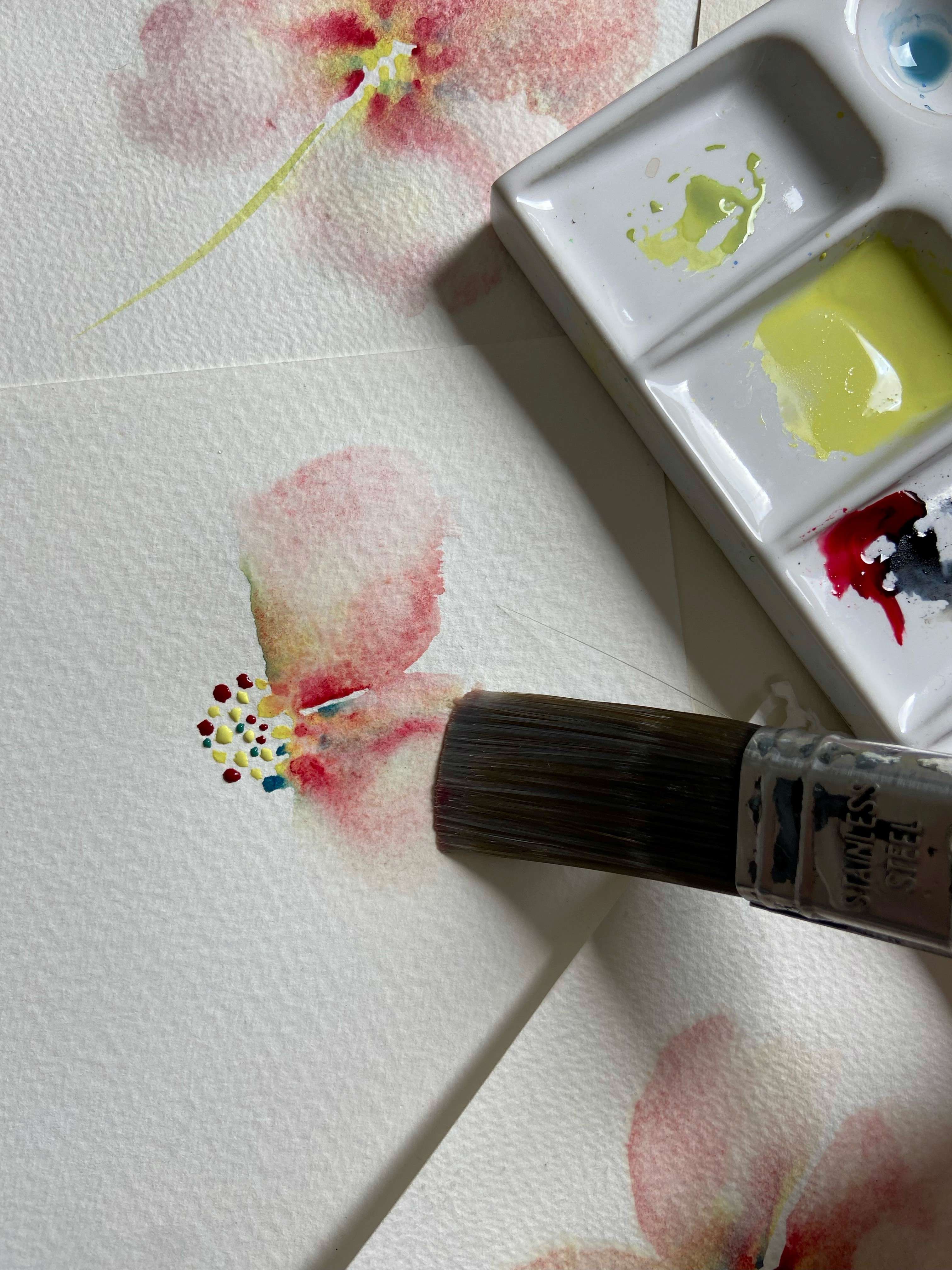 a close up of a watercolour flower on a greeting card