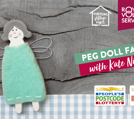 a DIY handmade blue peg doll fairy resting on a wooden table