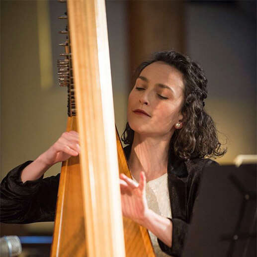 Harpist Anne Denholm performing with her harp