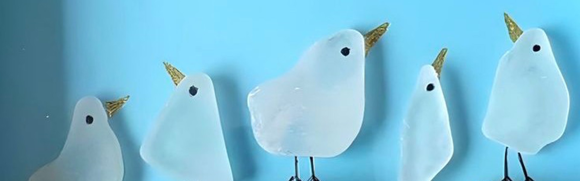Main image: sea glass bird art, cute little sea glass bird 'stood' on top of corks wrapped in string, with little legs, eyes and beaks drawn in marker pen. 