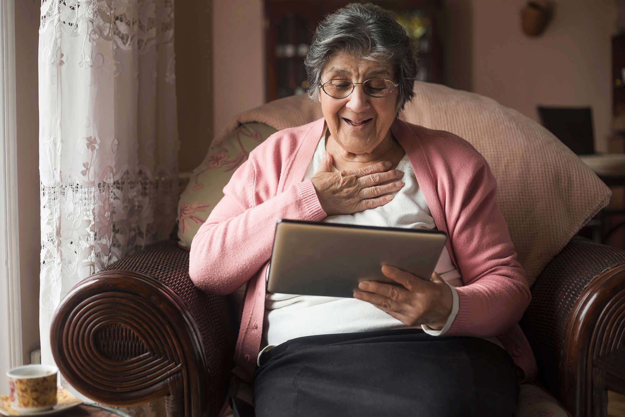 An older lady looking at a tablet