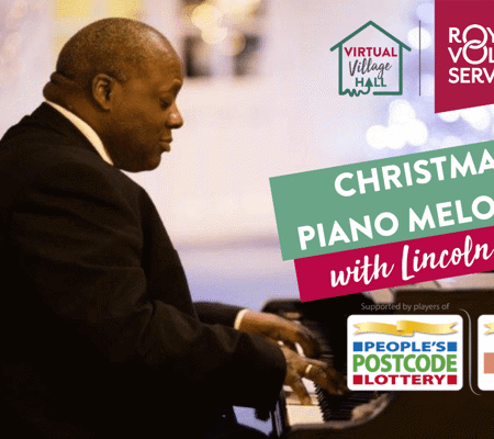 Pianist Lincoln Noel sat at a black grand piano with Christmas lights in the background