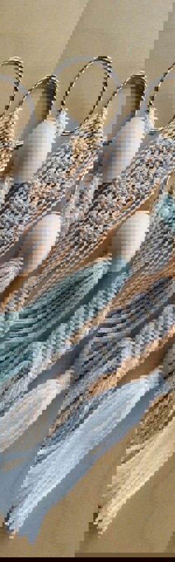 Main image: Cute Handmade Macrame Keychains made by Kate Nisbet, using white, cream and blue wool with wooden bead accessories.