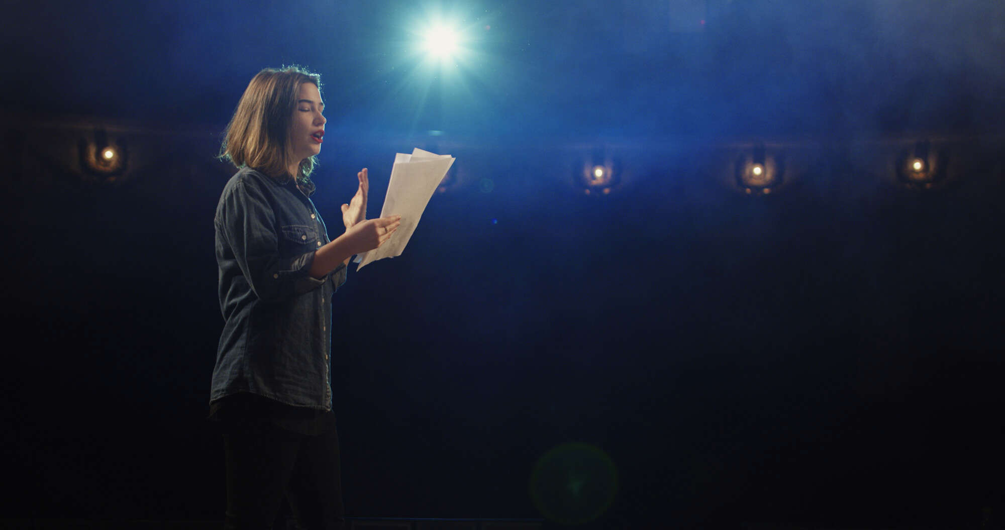 A woman reciting poetry