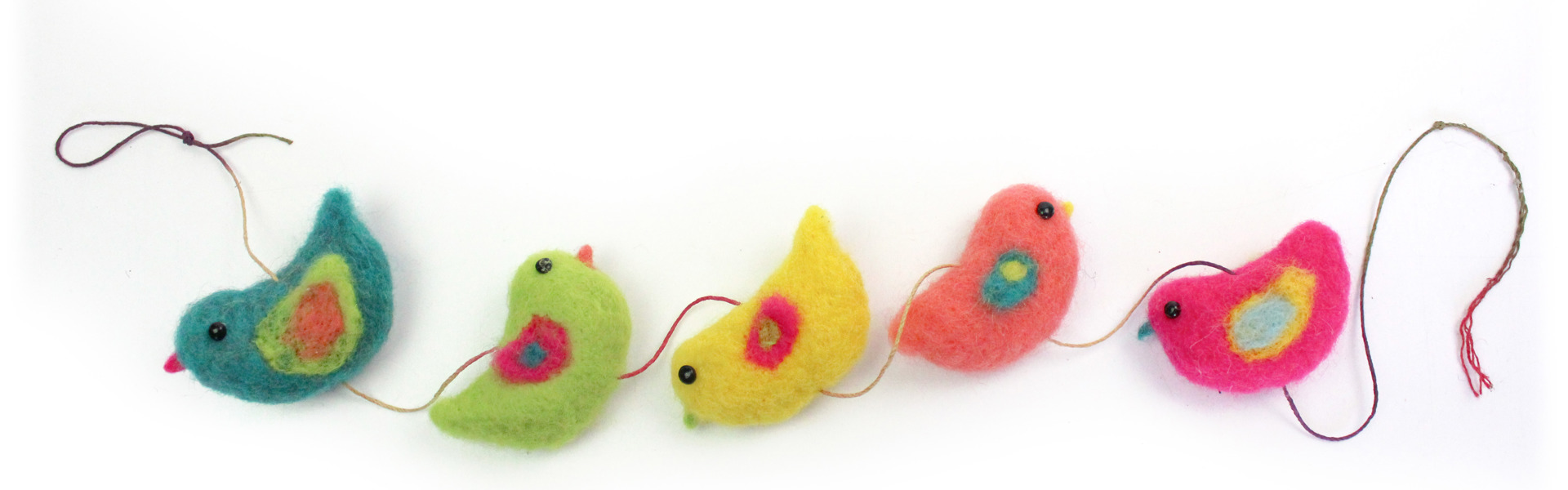 a string of needle felted multicoloured birds laid on a white background