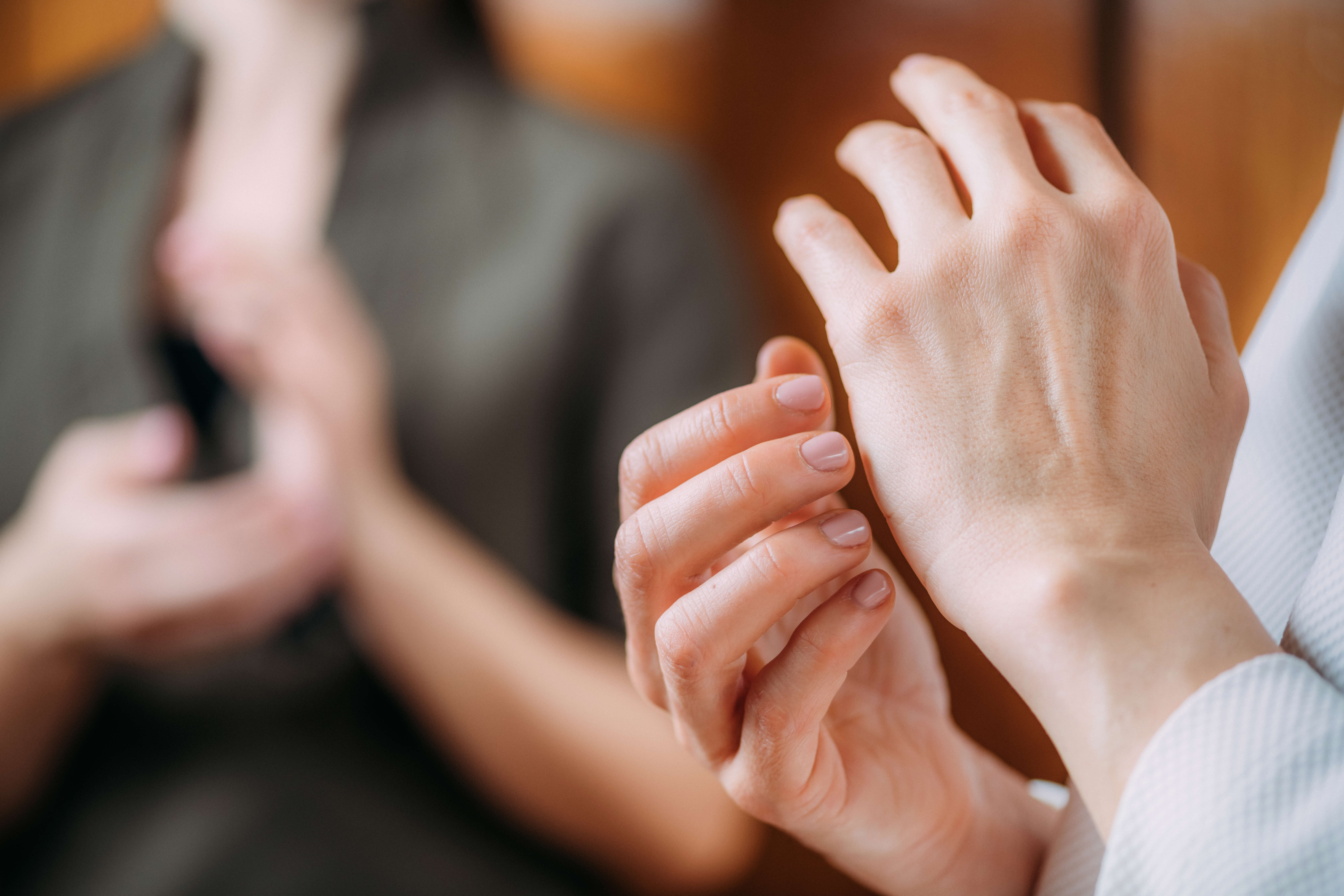 Main Image: a close up of someone practicing EFT Tapping, tapping on the side of their hand.