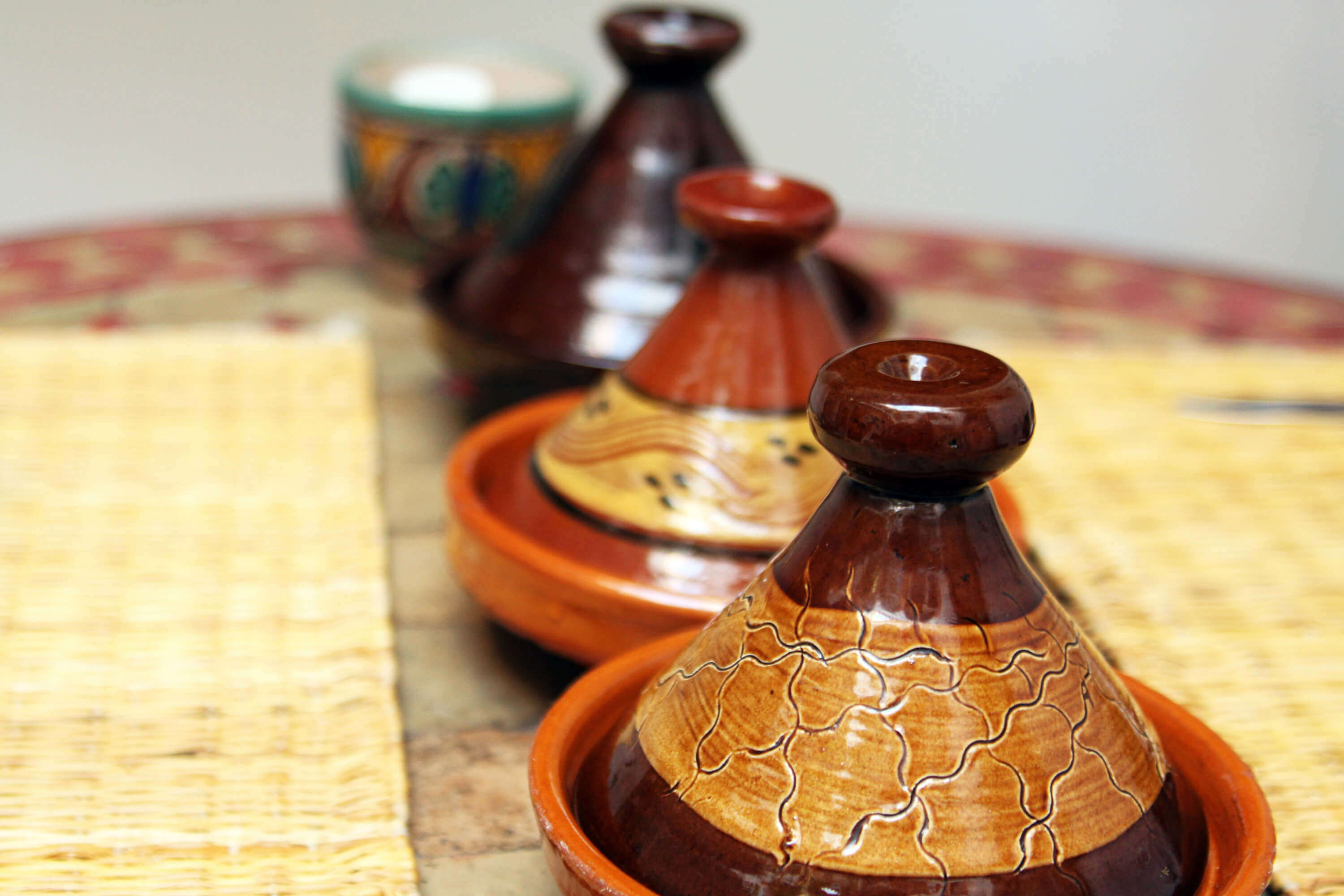 Authentic traditional ceramic Moroccan tagine pots in a row