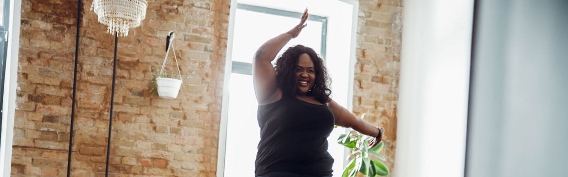 a woman dancing in her living room
