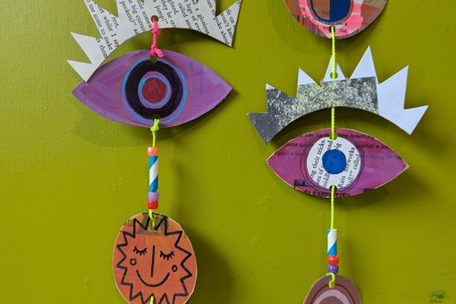 a close up of a mixed media hanging mobile made by Rosie Johnson