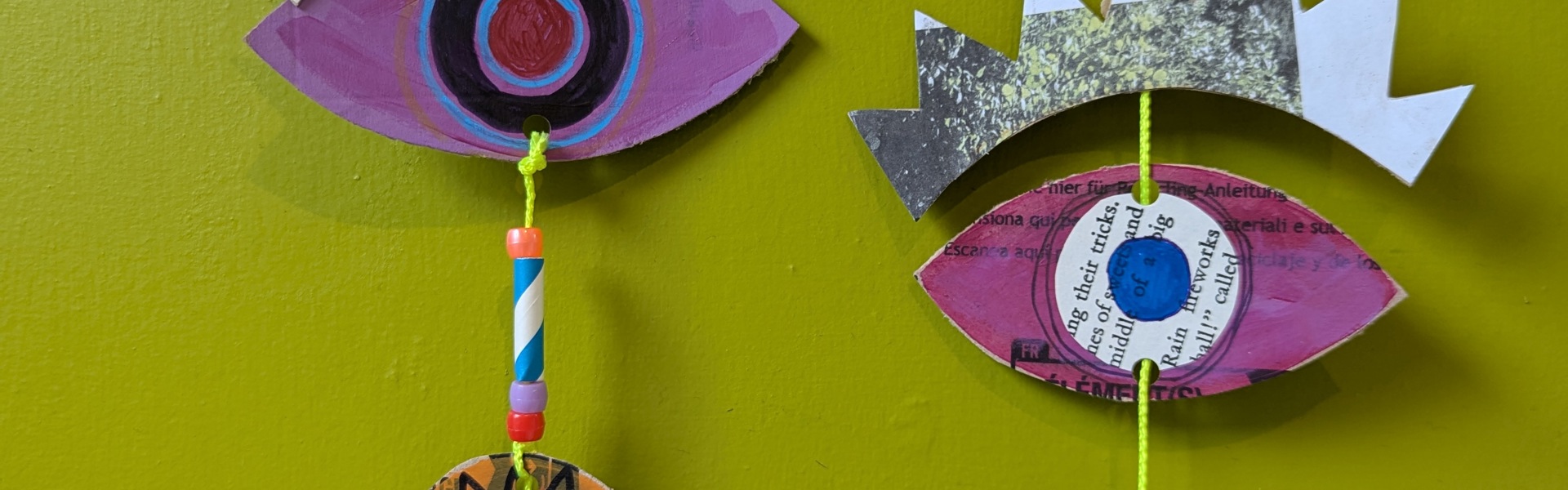 a close up of a mixed media hanging mobile made by Rosie Johnson