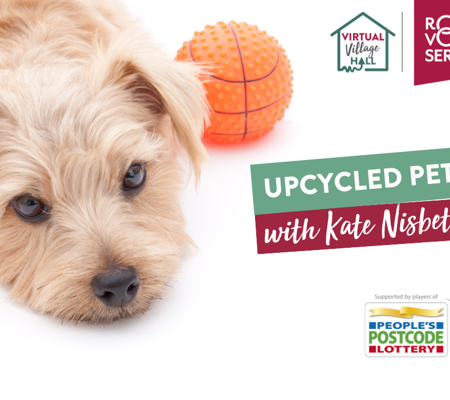 a blonde puppy laying on a white floor with a toy basketball next to it