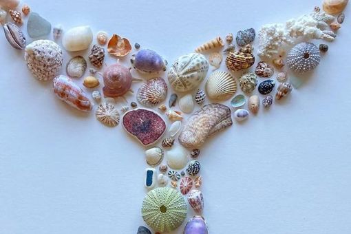 Main image: A whale tail shape seashell collage wall art on canvas.