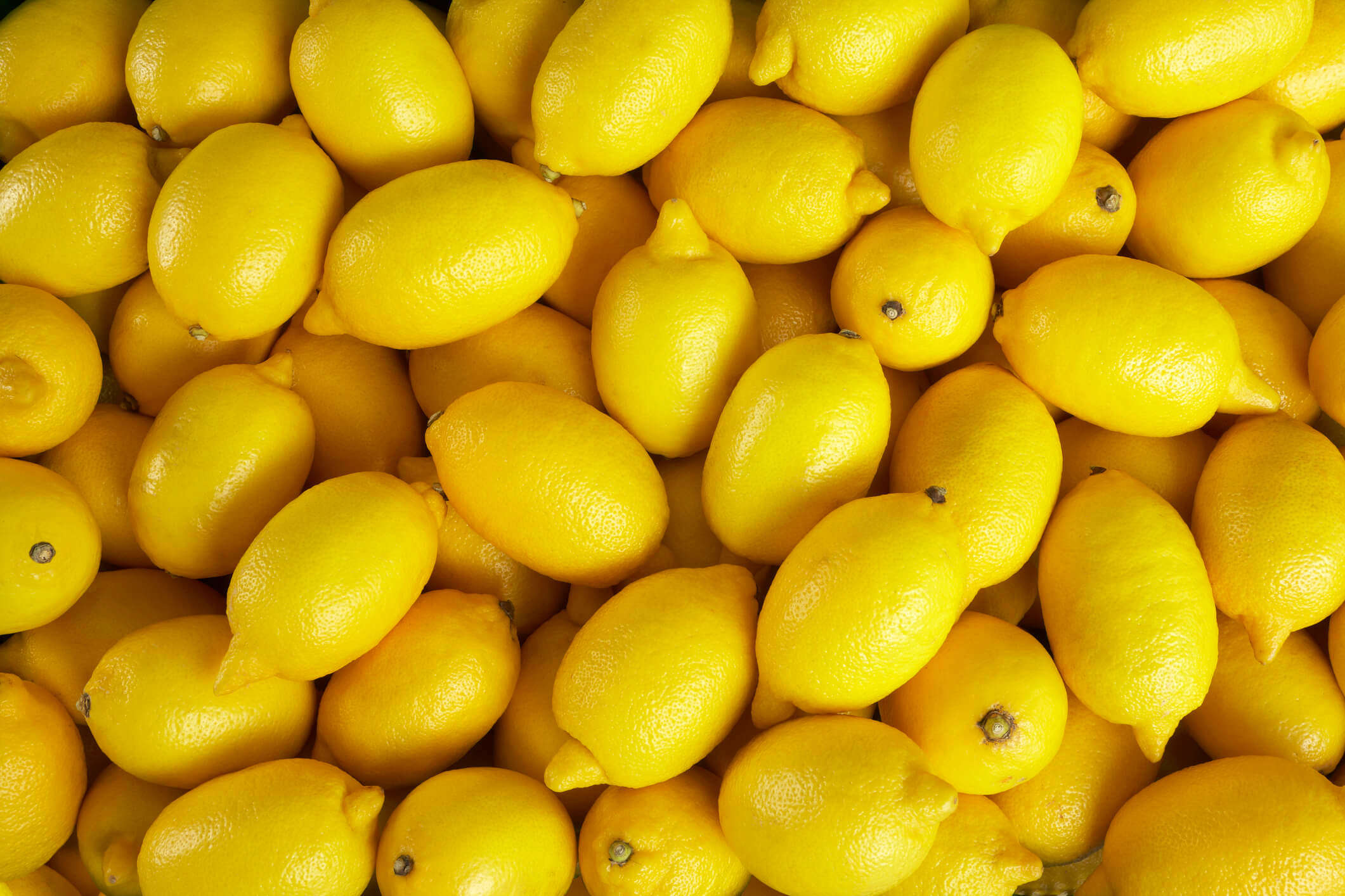 a pile of bright yellow lemons