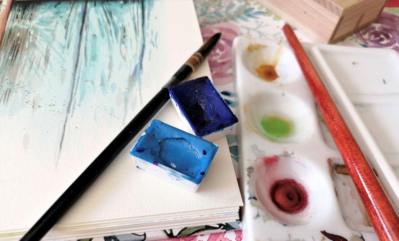 a close up of watercolour painting materials