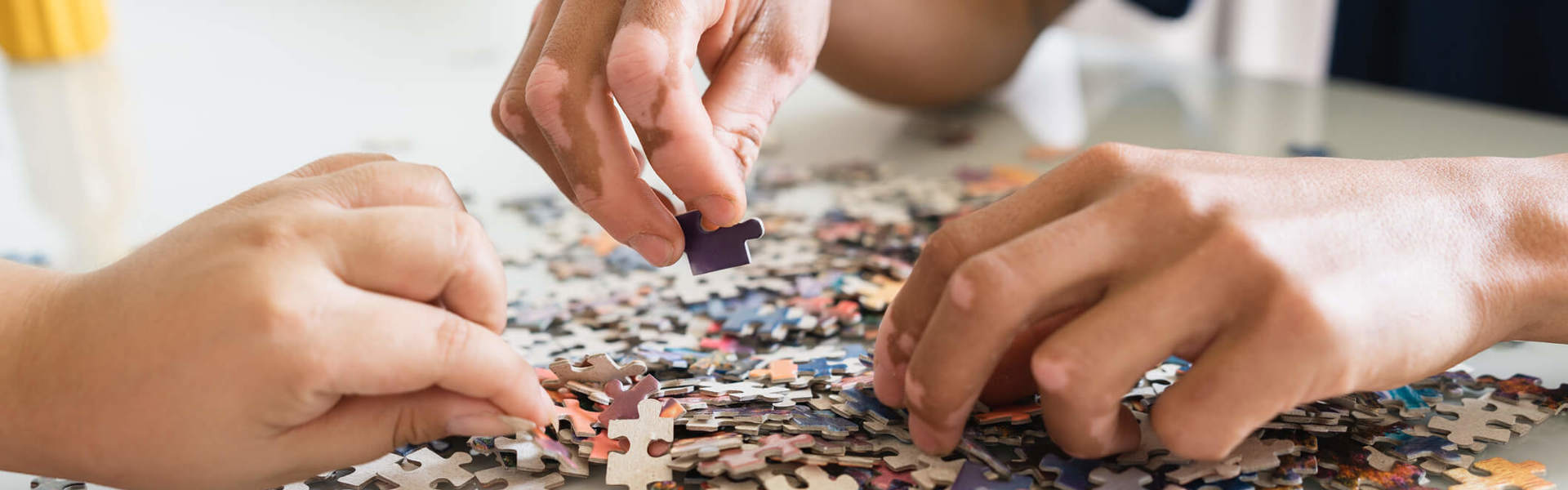 A couple working on a jigsaw puzzle