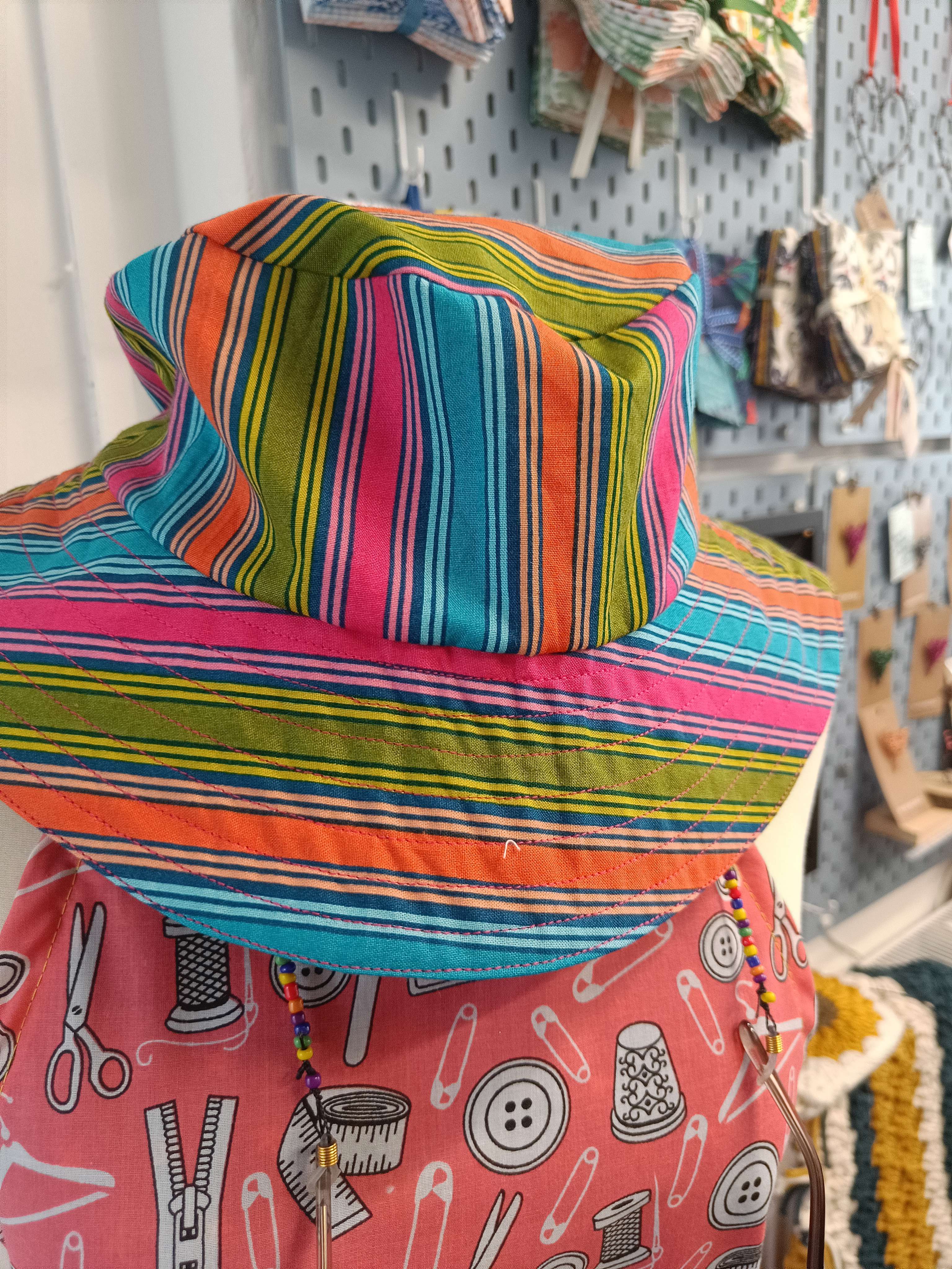 a summer bucket hat with a festival setting in the background