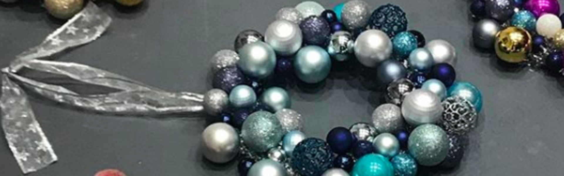 Handmade Christmas bauble wreaths laying on a table