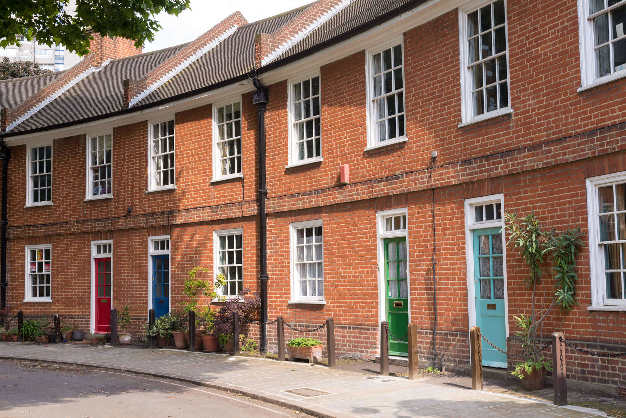 Restored Victorian red brick houses with coloured doors