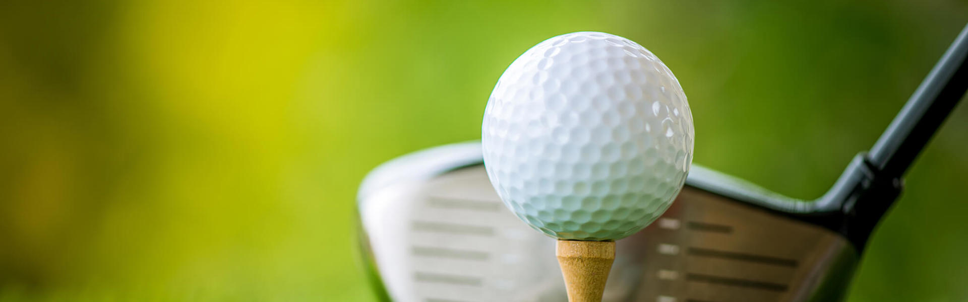 A golf ball and golf club