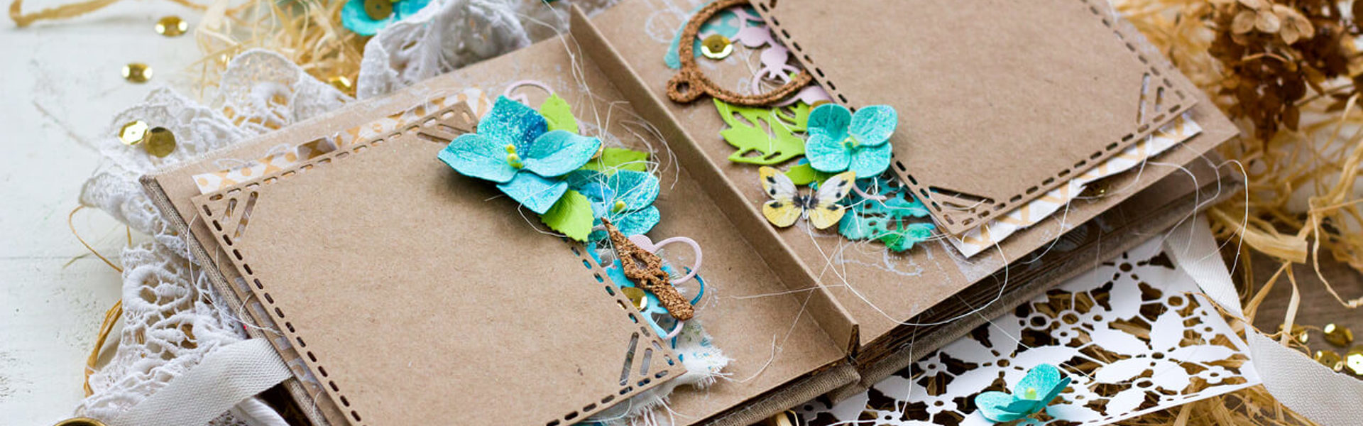 A leporello memory book adorned with colorful flowers and a vintage key resting on top, creating a charming and whimsical scene.