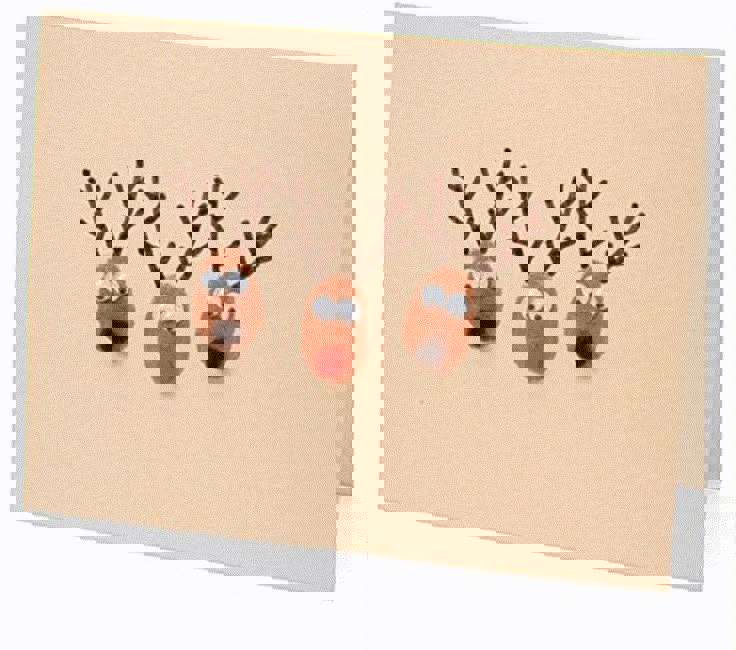 Main image: cute handmade Christmas card with three adorable reindeers faces on the front.