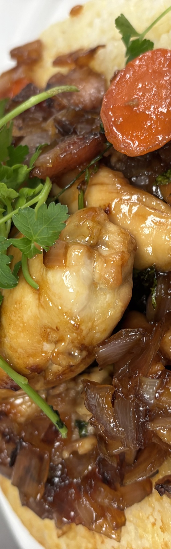 Main image: Sticky Marmalade Chicken on a bed of Crispy Fried Rice and slow cooked onions, with a bunch of parsley on the top.