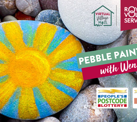 a close up of beach pebbles with one painted blue and yellow in the pattern of a sun