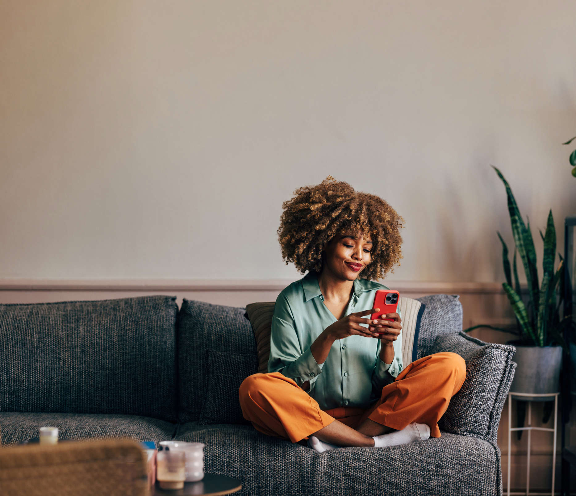 A young woman looking at her mobile phone 