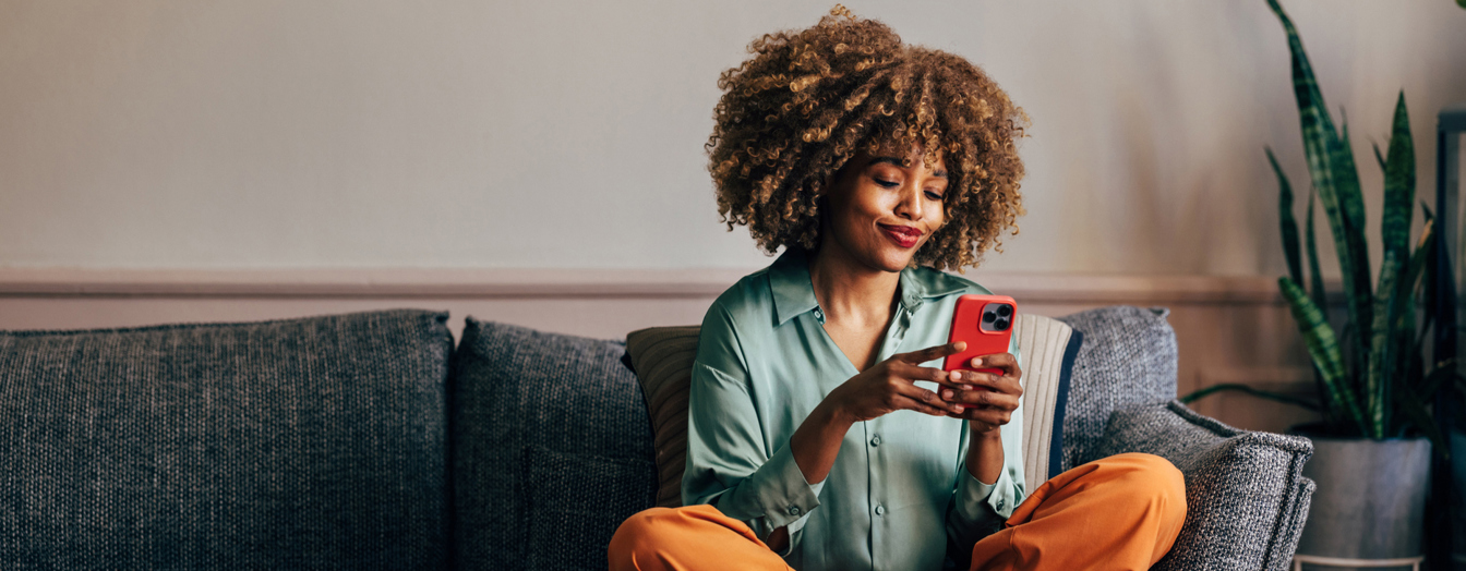 A young woman looking at her mobile phone