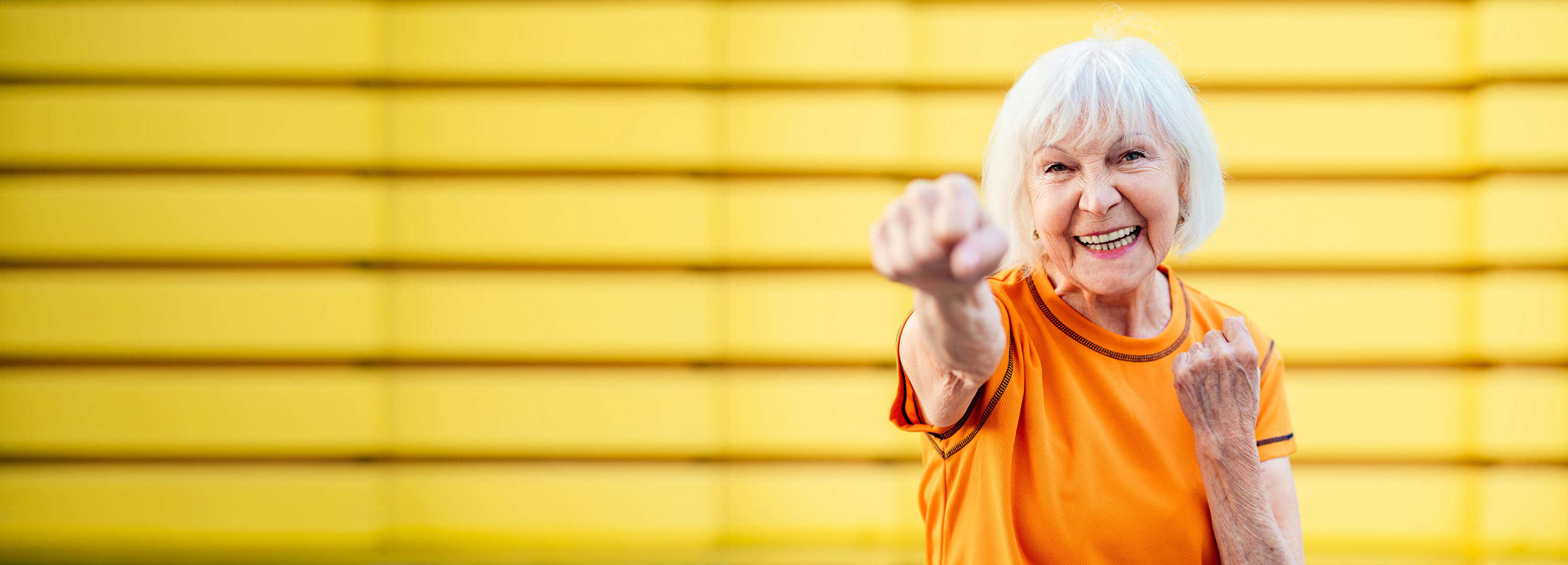 An older woman shadow punching