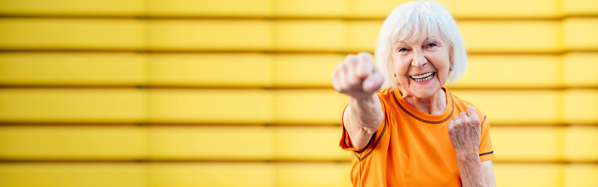 An older woman shadow punching
