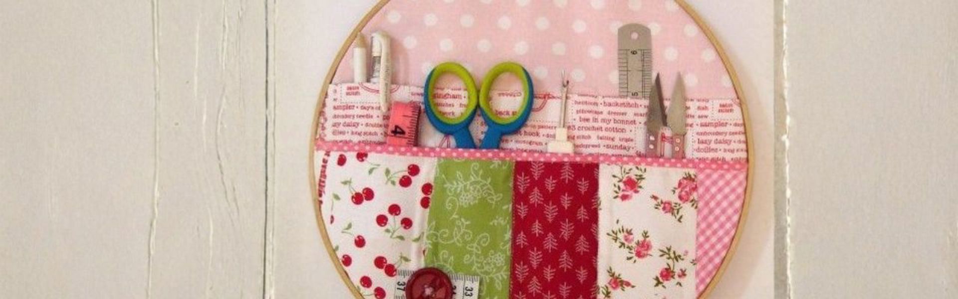 Main image: a DIY embroidery hoop organiser to store sewing essentials. In pink, green, red and white patterned fabrics. Also doubles as vintage-inspired décor. 