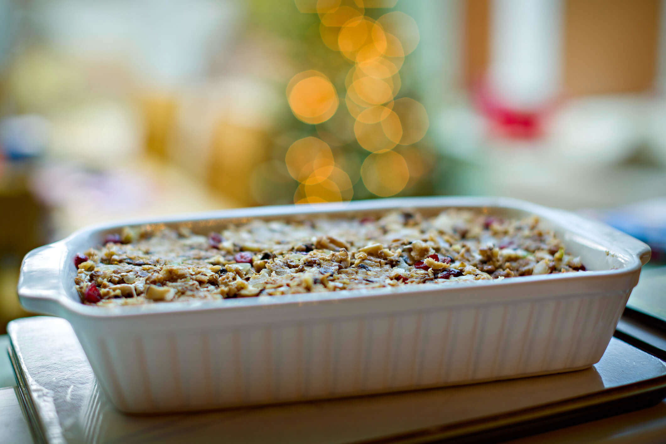 a Christmas nut roast in a white casserole dish