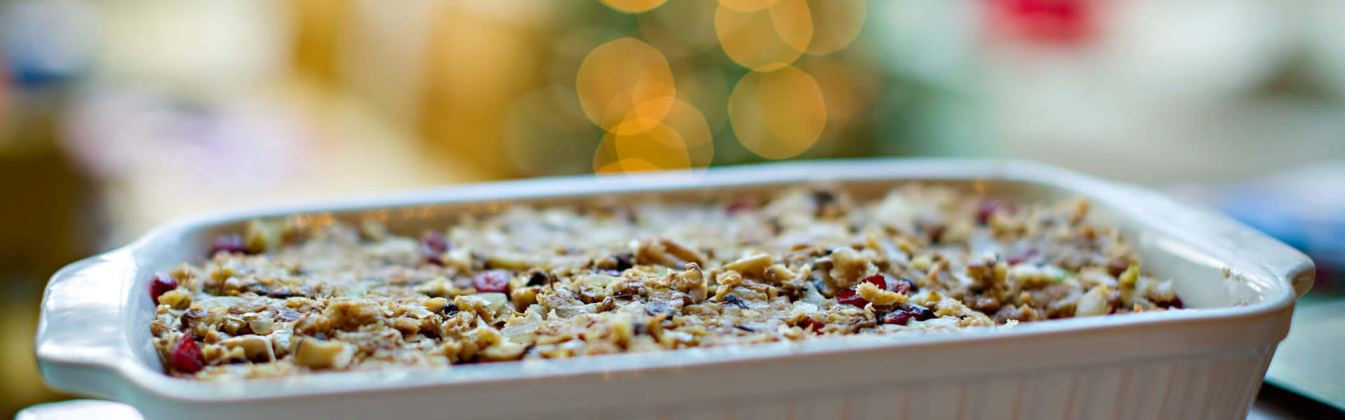 a Christmas nut roast in a white casserole dish