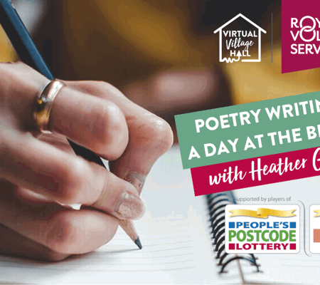 a close up of someone wearing a yellow jumper writing in a journal