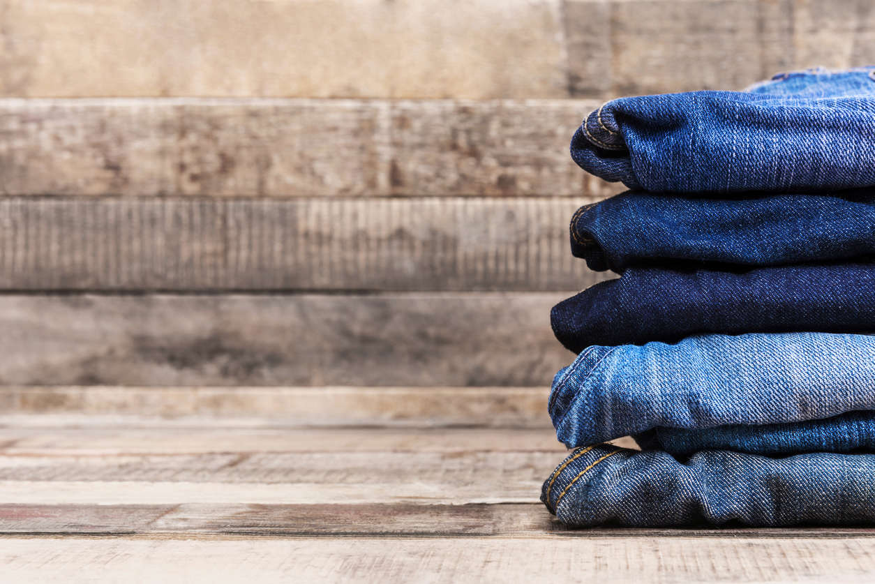 a pile of blue denim jeans