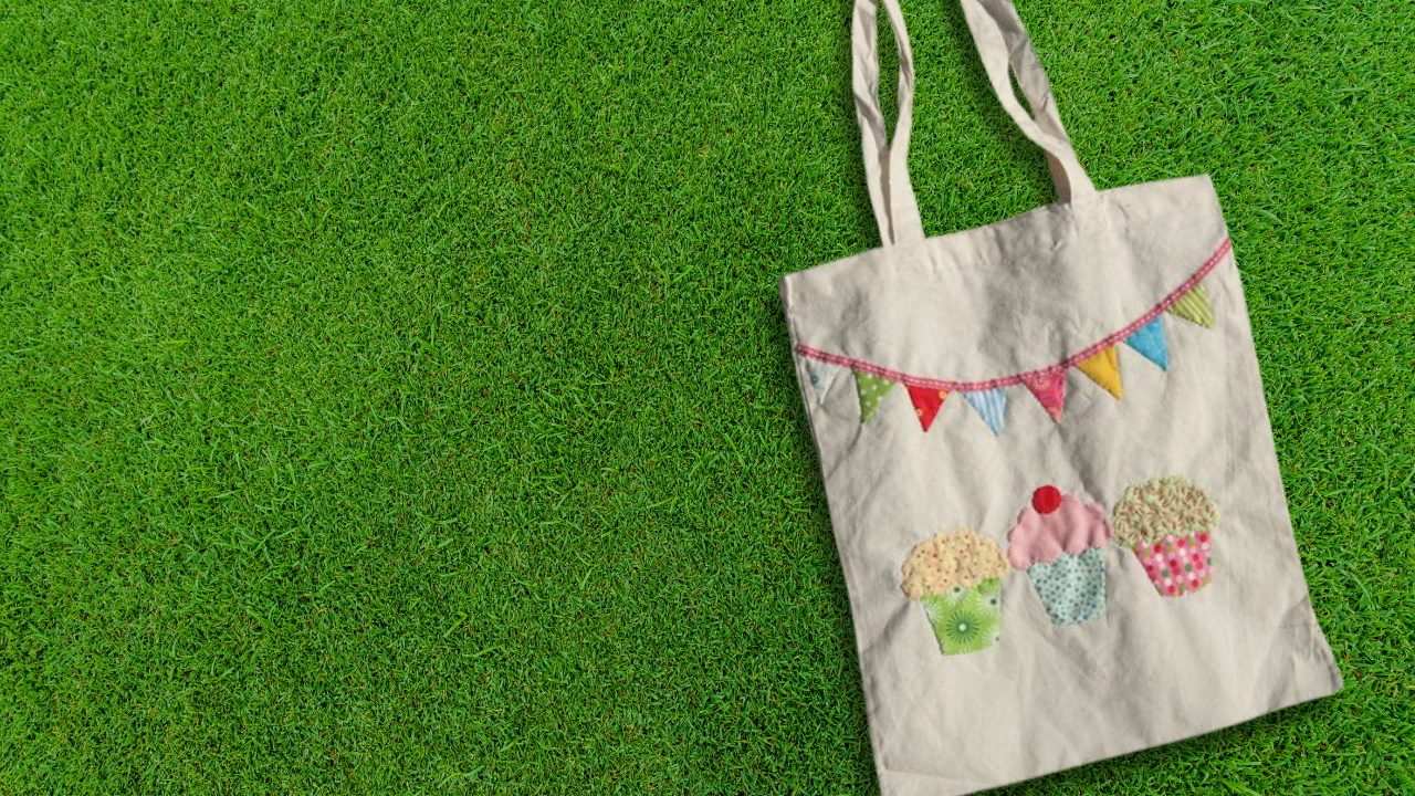 Main image: a DIY decorated tote bag, with fabric cupcakes and bunting, lay out on grass