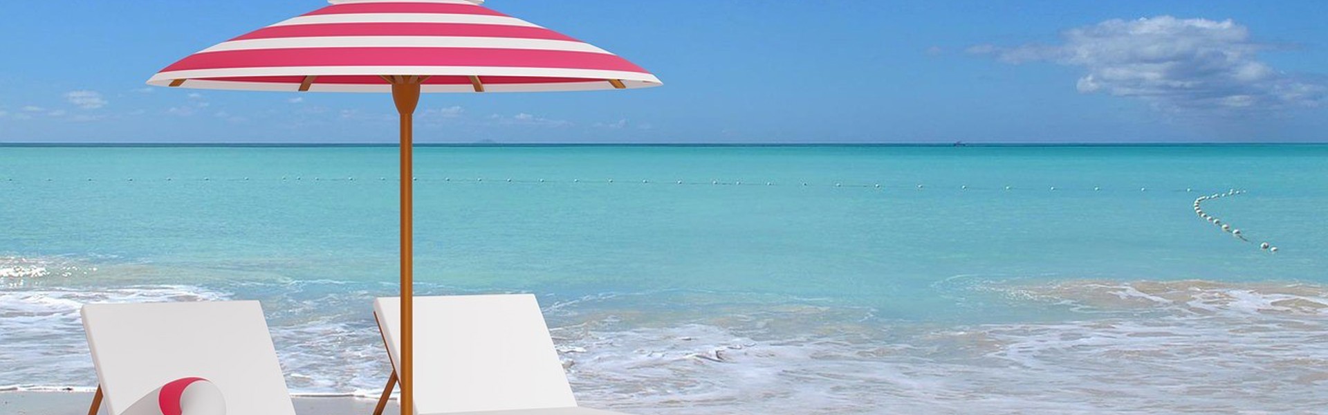 two beach deck chairs on a beach scene surrounded by beach balls flip flops and rubber rings