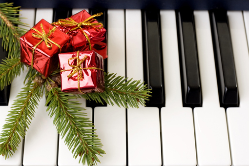 piano keys with a festive decoration resting on top