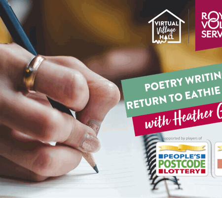 a close up of someone wearing a yellow jumper writing in a journal