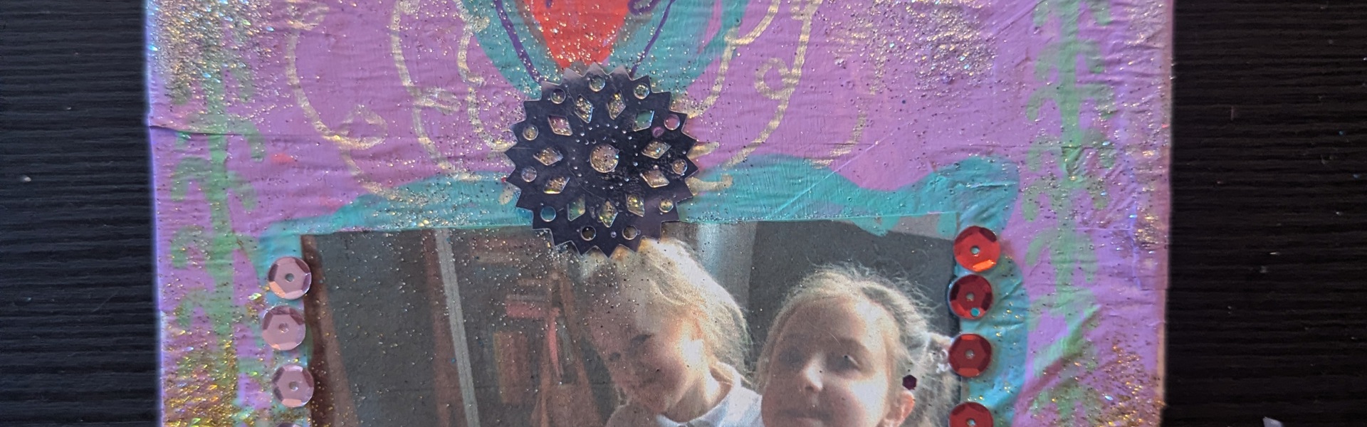 Main image: a mini altar, or DIY cardboard shrine painted in purple, with a photo in the middle and decorations. 