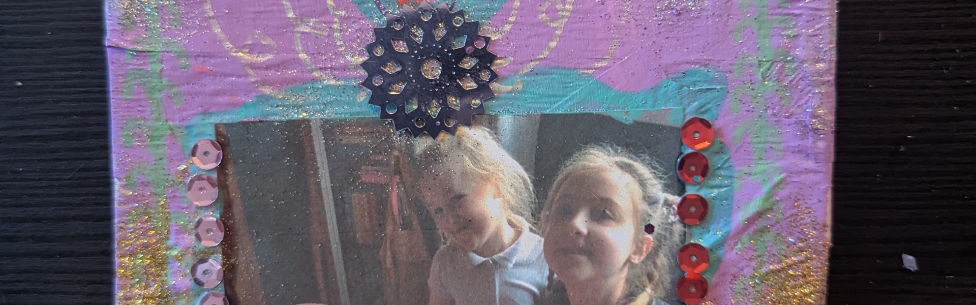 Main image: a mini altar, or DIY cardboard shrine painted in purple, with a photo in the middle and decorations. 