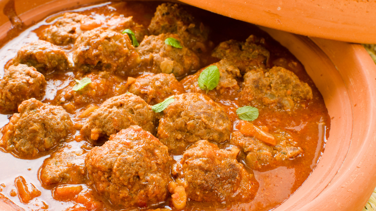 Main image: meatball tagine with lemon, in a terracotta tagine pot.