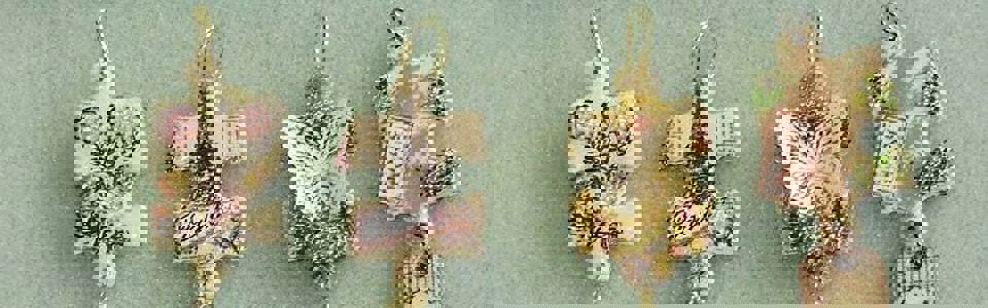Main image: DIY Jigsaw Piece Pendants decorated in different designs, with beads dangling from them.