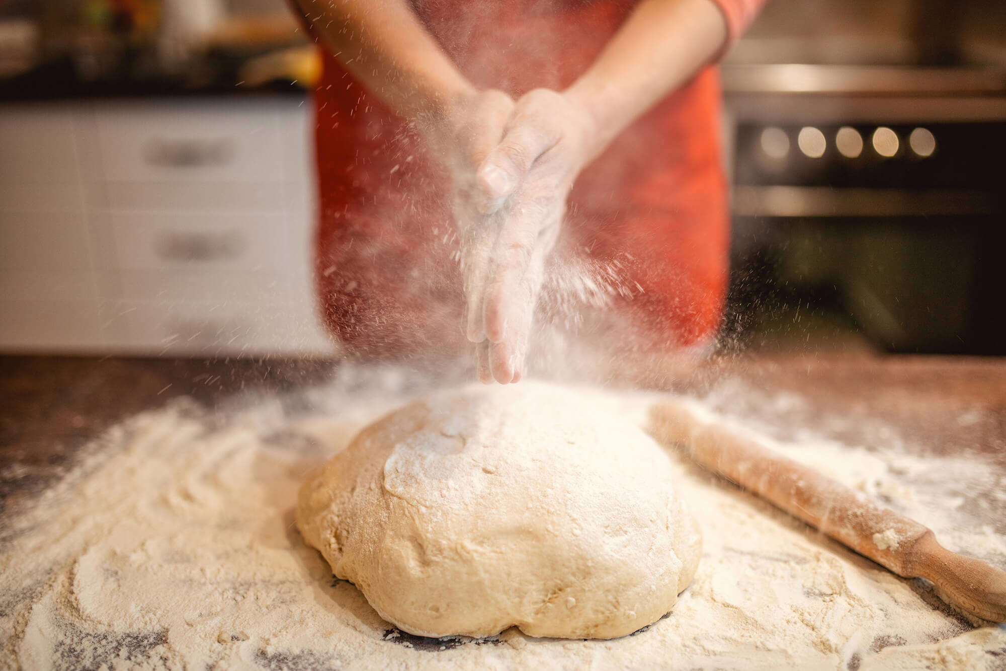 Someone kneading dough