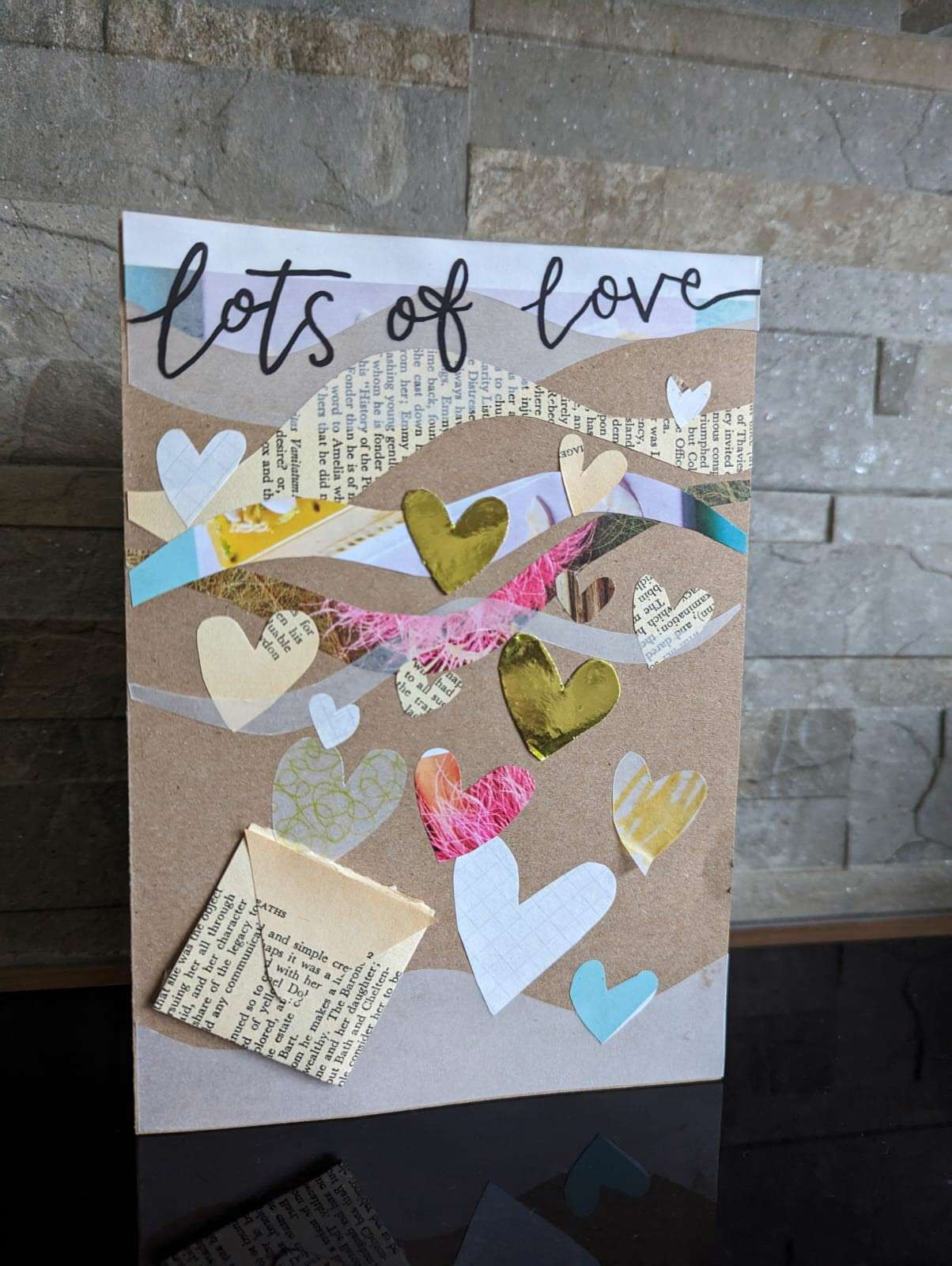 Recycled paper greetings cards in a variety of coloured paper with the header displaying the words "lots of love"