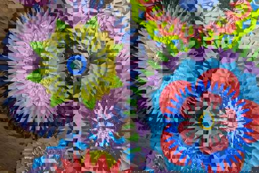 A close up of colourful DIY Christmas decorations made by Rosie Johnson