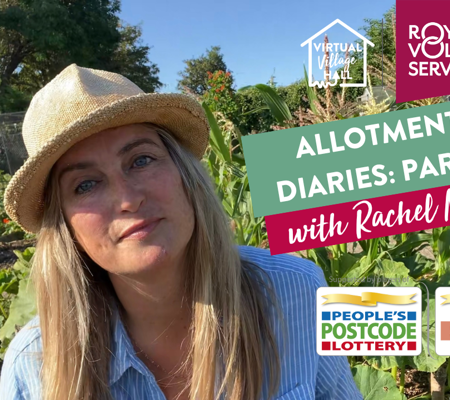 landscape photo of rachel moore wearing a hat in front of her allotment on a bright sunny day