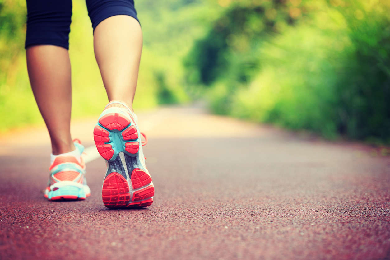 a person wearing running shoes outdoors